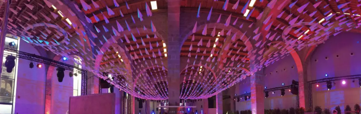 Venue with a pink and purple lit arched ceiling at the Telegram party at Mobile World Congress
