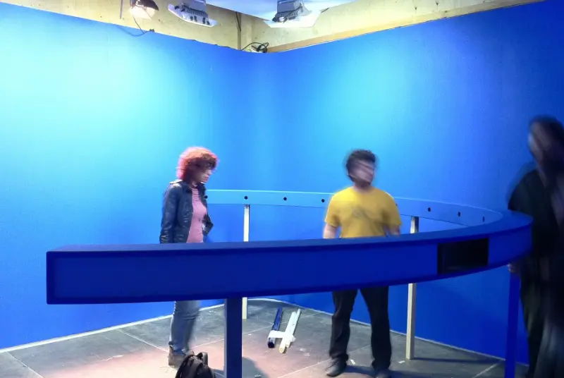 Visitors standing around the circular camera rail inside the blue Adidas Ghettorama booth