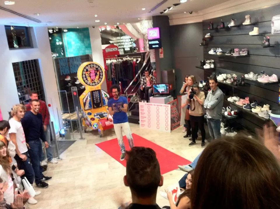 Visitors watching a participant inside a Diesel store during the Kick Ass Competition