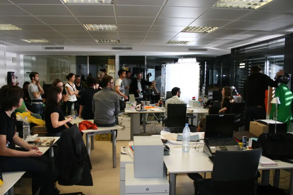 Open-plan office full of people working at desks