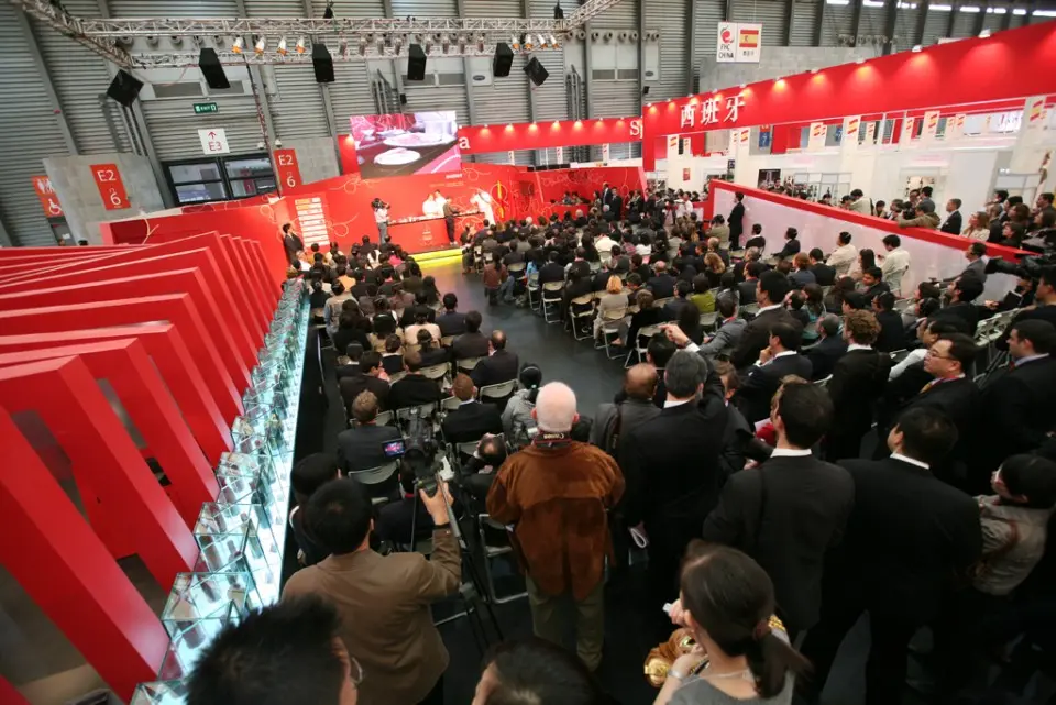Crowd and photographers at the opening of the red Spanish Culinary Area showroom